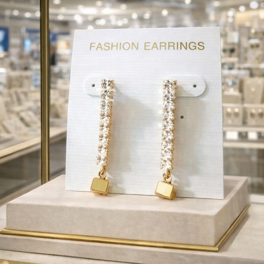 Women's rhinestone and gold earrings